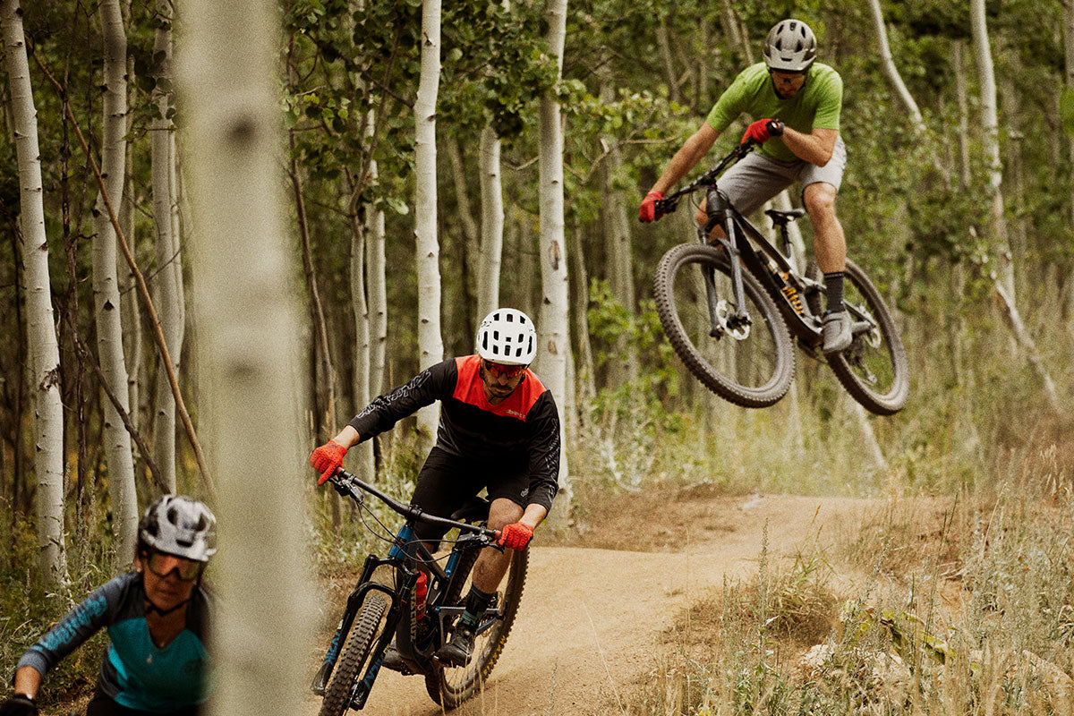 Mountain bikers getting rad on a trail